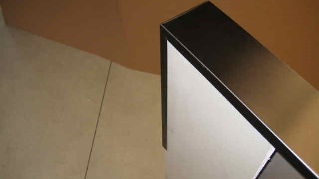 Clear and dark brown anodized mullion/low wall cap.