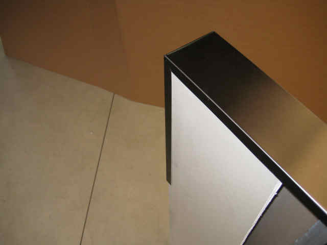 Clear and dark brown anodized mullion/low wall cap.  